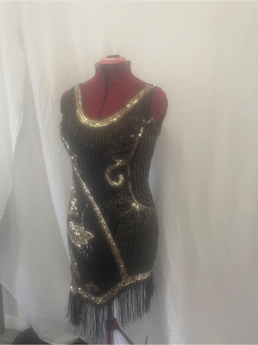 Black and Gold Beaded Fringe Cocktail Dress with accessories.